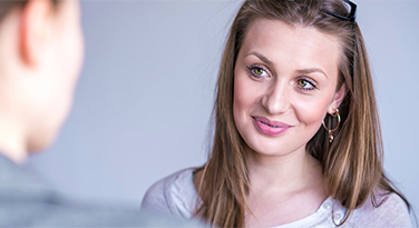 A teenage girl listening to her dentist during a consultation in Clapham Common, London