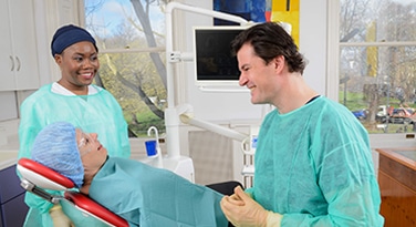 Our dentist Andreas Jahnigen with a patient at Crescent Lodge Dental Practice