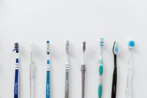 Different types of toothbrushes lined up in Clapham dental practice